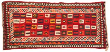 A Qashgai Kelim, the wine field with rectangular serrated medallions in various colours,