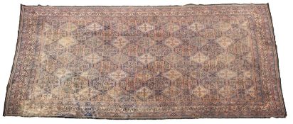 A machine made carpet of Persian design,
