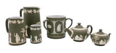 Six pieces of Wedgwood sage jasper ware comprising a garniture of three jugs, a tyg,