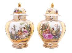 A pair of German porcelain baluster vases and covers decorated front and verso with panels