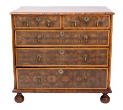 A William and Mary oyster laburnum veneered chest of drawers,