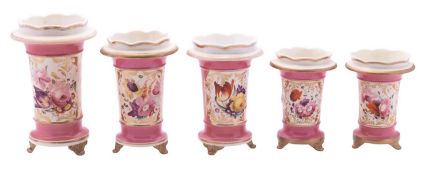 A garniture of three Coalport pink-ground spill vases and a similar pair,