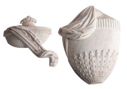Two carved marble reliefs of draped urns, first half 19th century; the larger example 42cm high,