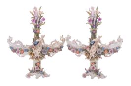 A pair of Continental porcelain table centrepieces each modelled with a pair of pierced flower