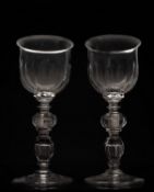 A pair of large cut glass goblets the ogee bowls
