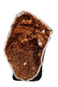 A large smoky quartz (amber-brown) half geode,