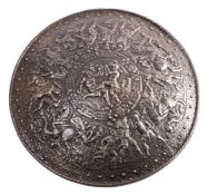 A Victorian polished cast iron model of a circular shield,