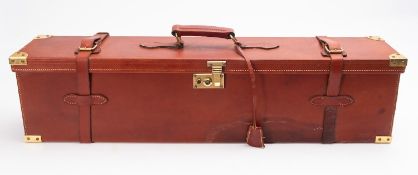 A brown leather and brass double gun case, maker Artesania F. Esposito, to fit 28 inch barrels.