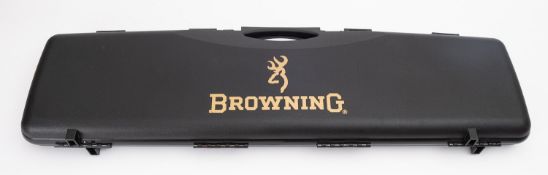 A Browning hard shell gun case and two parts gun cleaning kits (3)