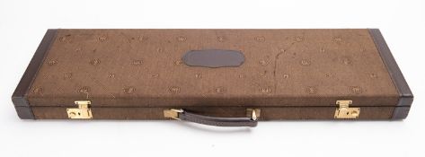 A hard shell canvas and leather brown Beretta Shotgun Case, monogrammed, fit for 30 inch barrels.