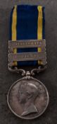 A Victorian Punjab Medal with two clasps to 'Rough Rider John Cockayne 2nd Tp 3rd Bde H ART'
