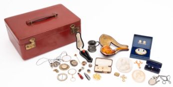 A mixed collection of costume jewellery in a red leather jewellery box.