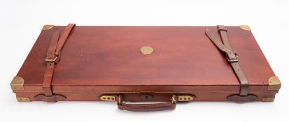 A brown leather and brass double gun case., 85x36.5cm.