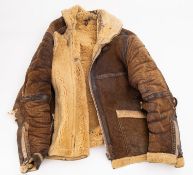 A WWII era British leather flying cap and jacket.
