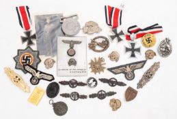 A Collection of various German army badges and insignia,