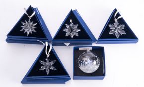 A Collection of modern Swarovski crystal Christmas ornaments.