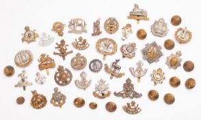 A collection of British Regimental caps badges and buttons,
