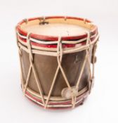 An early 20th Century brass and painted wooden marching drum.