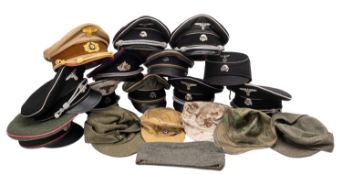 A group of fifteen German Army re-enactment peaked caps and others.