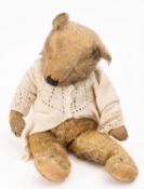 An early 20th Century mohair teddy bear.