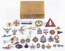 Al collection of silver and enamel badges.