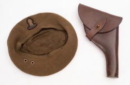 A WWII era Royal Marines wool beret. With felt badge, together with a leather holster.