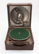 An early 20th century Decca 'Junior' gramophone, serial number '5597' in a brown leather case, 20.