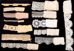 A quantity of various lengths of lace trim, including handmade and machine lace examples.