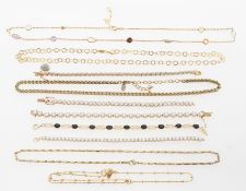 A selection of silver gilt jewellery pieces to include three line bracelets