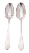 A pair of early 18th century wavy-end or Dognose silver tablespoons, with moulded rattails,