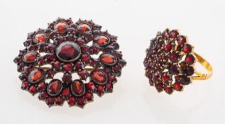 A garnet set cluster ring, marked 9ct, size N 1/2, gross weight 4.