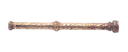 A Victorian gold coloured* propelling pencil, with raised foliate scroll borders,