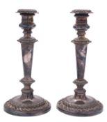 A pair of silver plated three-light candelabra, with gadroon borders, spool-shaped capitals,