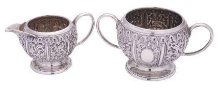 A late Victorian silver sugar bowl & matching milk jug, of circular form,