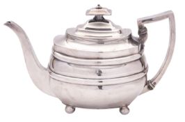 A George III silver tea pot, of rounded oblong form, with a cushion finial,