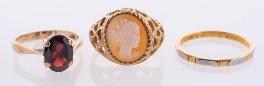 Three gold rings, comprising of a 22ct bi coloured gold bang, gross weight 2.
