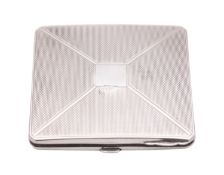 A George VI silver compact, of canted square form and with engine-turned decoration,