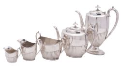 A Victorian five-piece silver tea and coffee service, oval form,