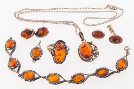 Two sets of amber jewellery on white metal marked 925, consisting, amber pendant,