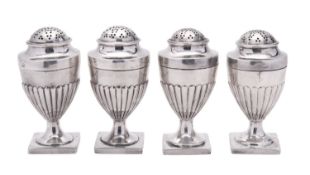A George III set of four South West provincial silver pepper casters, vase-shaped,