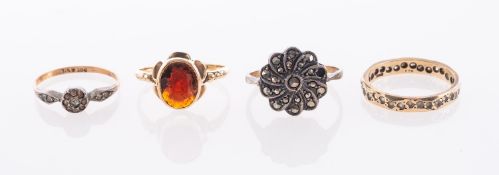Four 9ct hallmarked and stamped stone set rings,
