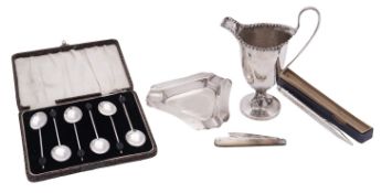 A mixed lot of various silver, to include a George III helmet-shaped cream jug, an ashtray,