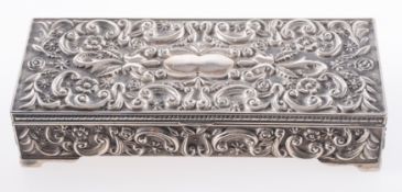 A collection of silver jewellery items in a silver plated box.