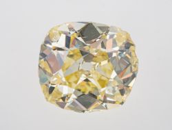 ! An impressive light / fancy light yellow old mine cut diamond weighing approximately 5.25 carat,