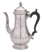 A George V silver coffee pot, of baluster form, with a wooden scroll handle,