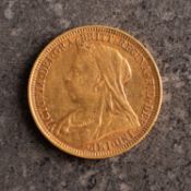 A Victorian sovereign, Old veiled bust, reverse with St. George and The Dragon and dated 1894
