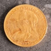 A Queen Victoria sovereign, old veiled bust, reverse with St George and The Dragon,