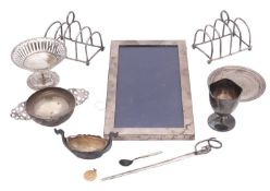 A mixed lot of various silver, to include a pair of toast racks, a mounted photograph frame,