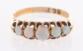 A Victorian opal five stone ring on 18ct hallmarked gold,