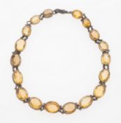A Citrine riviere choker necklace, in white metal with oval cut citrine,